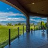 Take in the lake and vineyard views from this stunning custom upper mission home